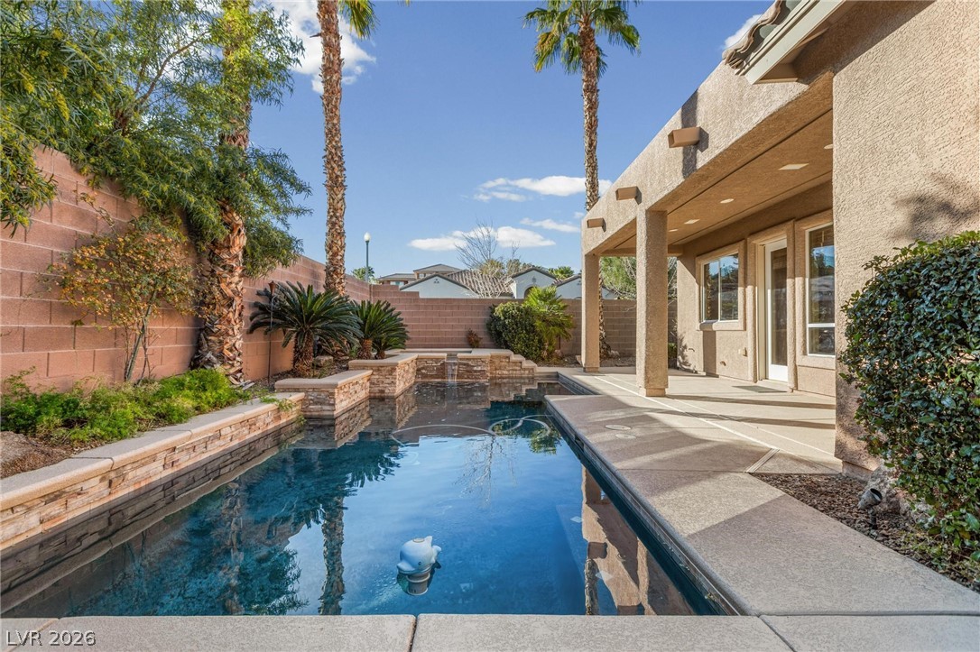 11425 Rancho Portena Avenue Las Vegas, NV 89138 - Photo 50 of 58 View of pool with a fenced backyard and patio surround