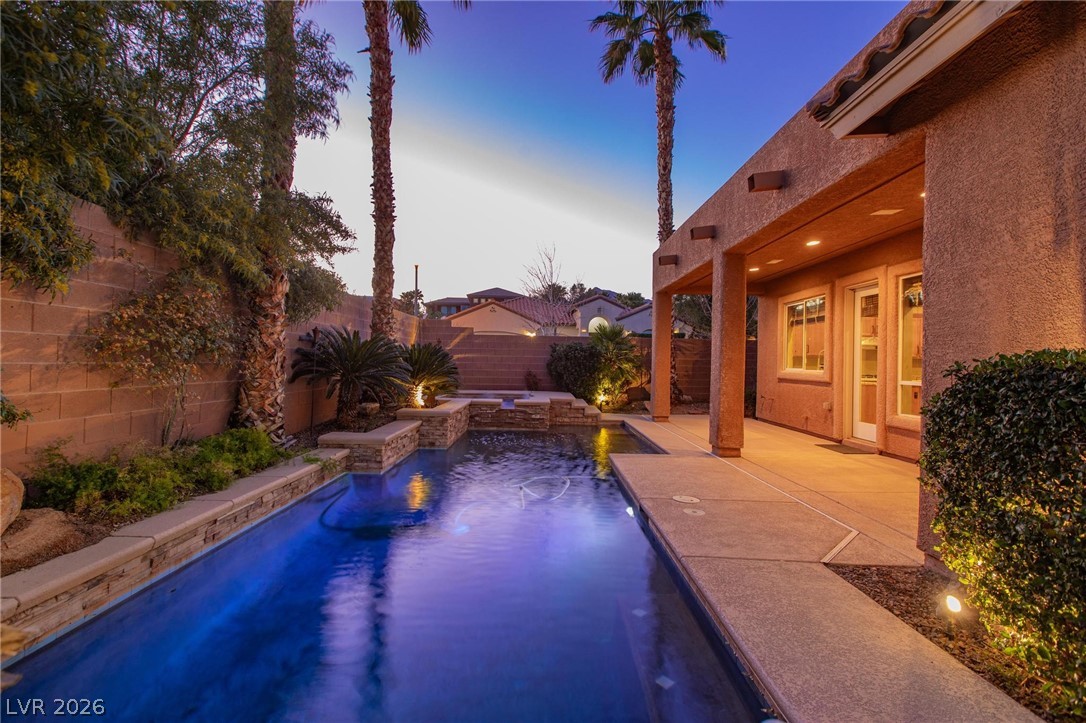 11425 Rancho Portena Avenue Las Vegas, NV 89138 - Photo 7 of 58 View of pool featuring a fenced backyard and patio surround