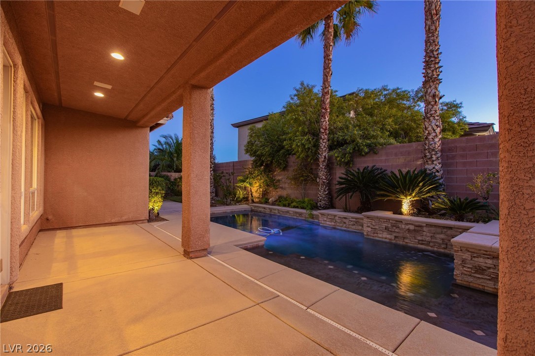 11425 Rancho Portena Avenue Las Vegas, NV 89138 - Photo 10 of 58 View of swimming pool with patio surround and a fenced backyard