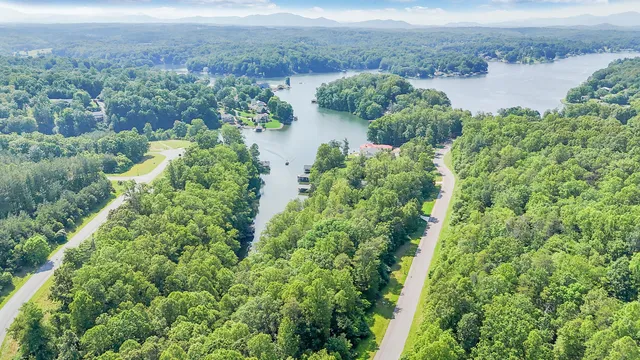 a view of a house with swimming pool and a chairs