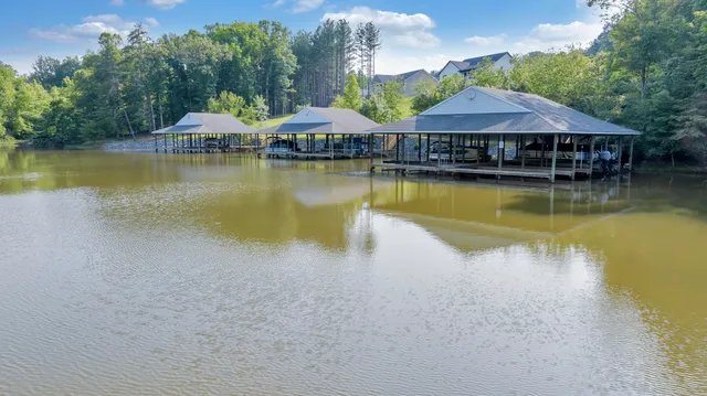 a house with swimming pool in front of it