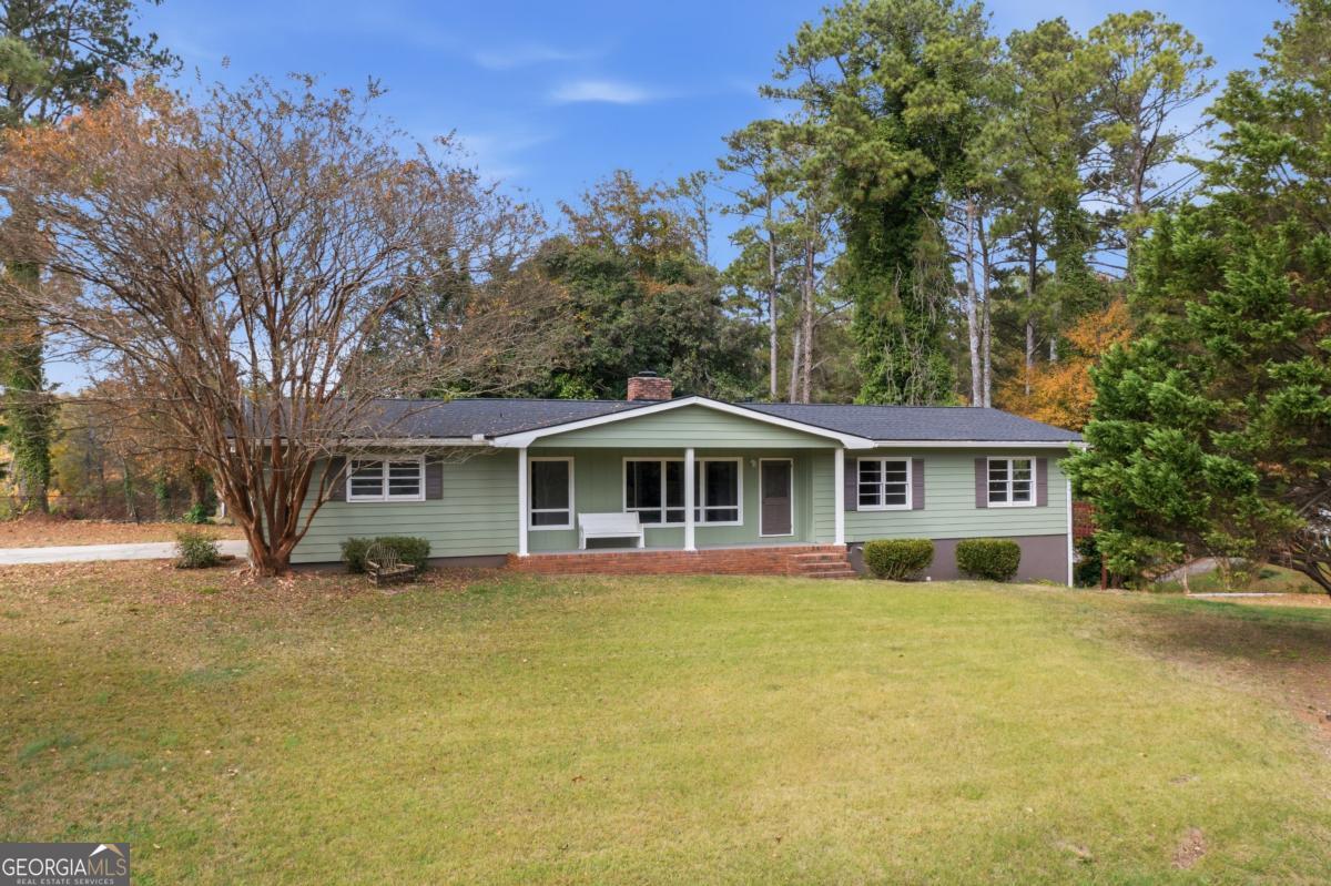 14 Mitchell Circle Rome, GA 30161 - Photo 2 of 39 a view of a house with a big yard and large trees