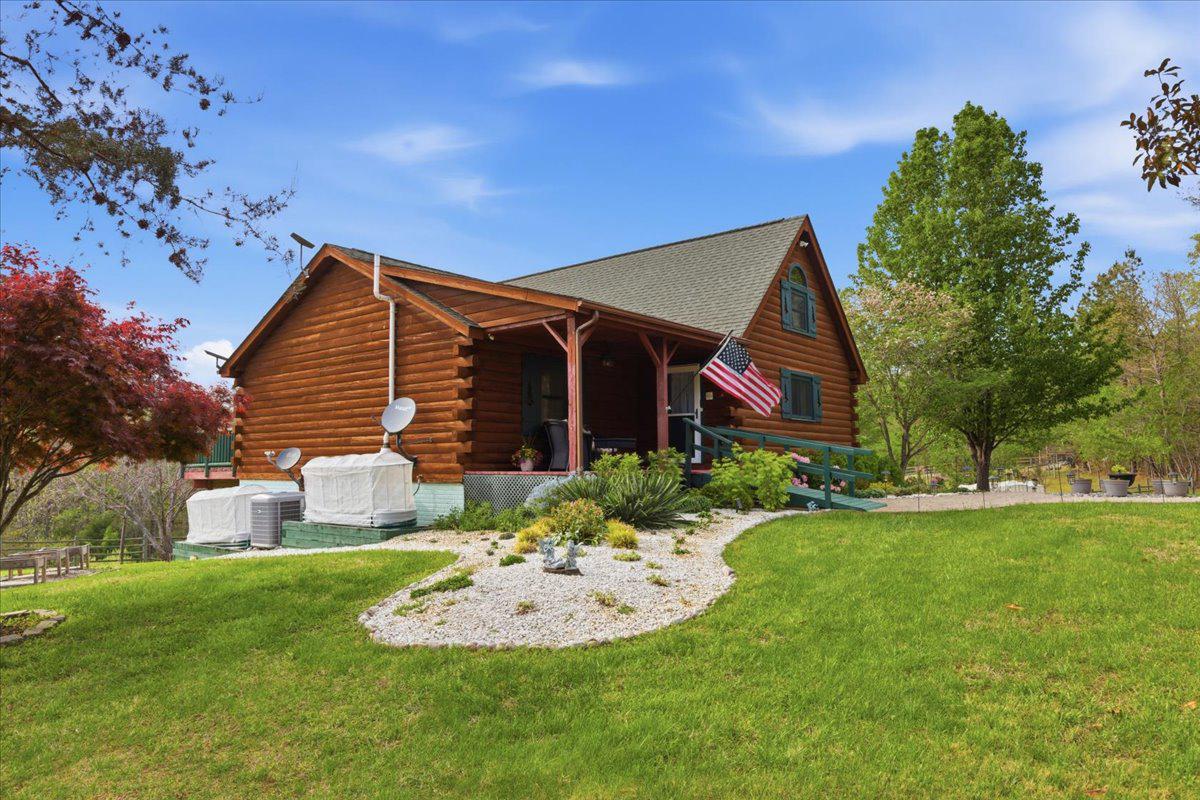 15240 Sheads Mountain Road Rixeyville, VA 22737 - Photo 4 of 70 Charming log cabin w/ lush greenery & landscaping