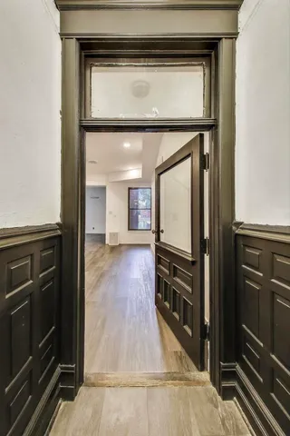a kitchen with a stove and a wooden cabinets