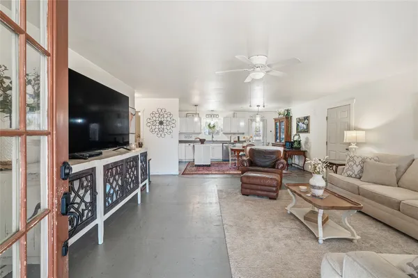 a living room with furniture and a flat screen tv