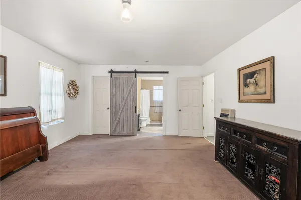 a bathroom with sink shower and mirror