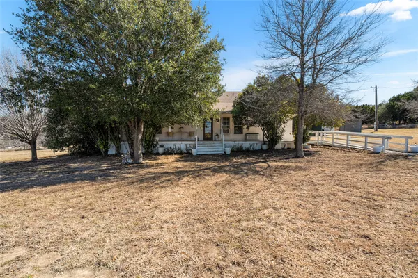 an aerial view of mountain with yard