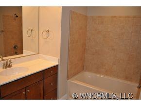 305 Nottingham Road Maggie Valley, NC 28751 - Photo 3 of 10 a bathroom with a sink and a mirror