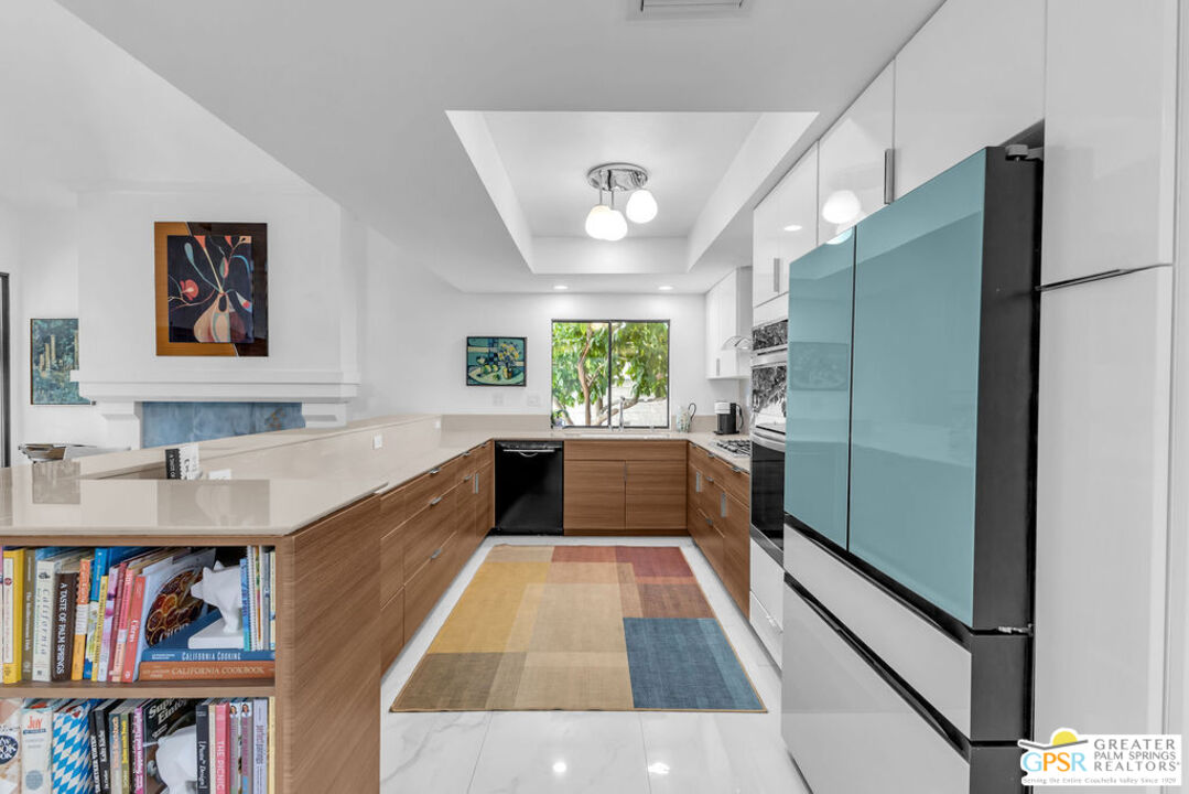 12 Santa Clara Drive Rancho Mirage, CA 92270 - Photo 12 of 34 a kitchen with stainless steel appliances granite countertop a refrigerator and a sink