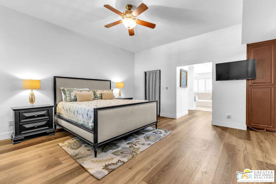 12 Santa Clara Drive Rancho Mirage, CA 92270 - Photo 18 of 34 a bedroom with a bed and a flat screen tv