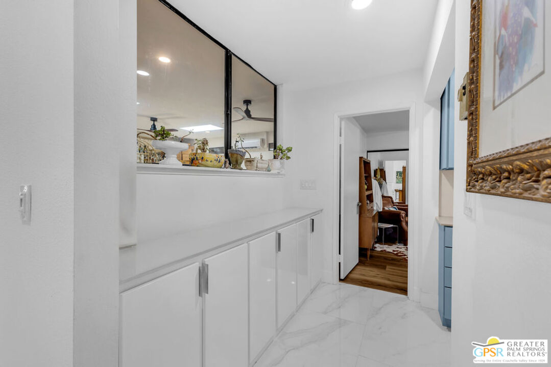 12 Santa Clara Drive Rancho Mirage, CA 92270 - Photo 22 of 34 a view of a hallway with wooden shelves