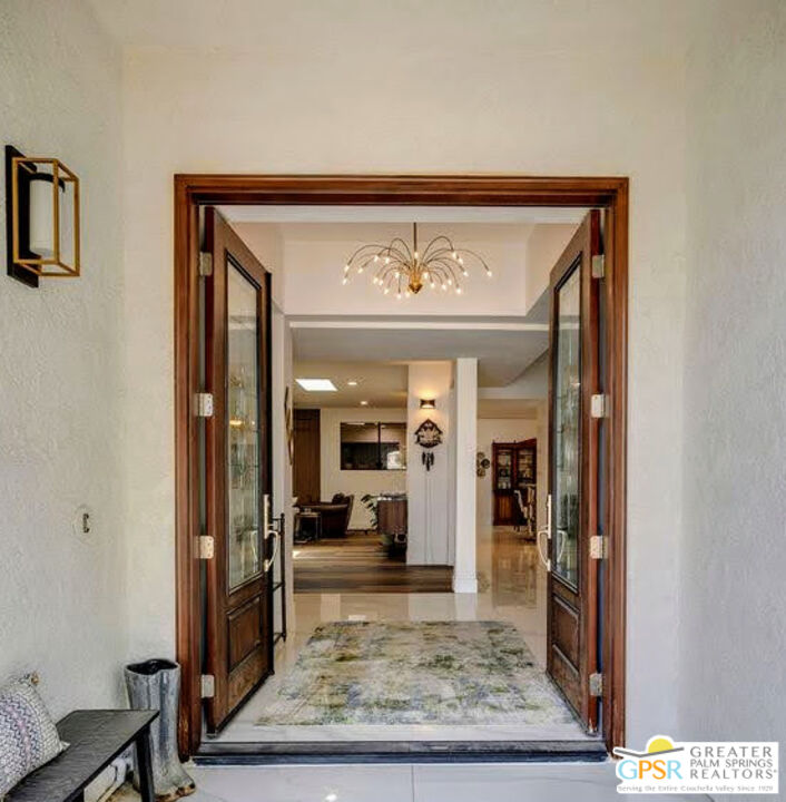 12 Santa Clara Drive Rancho Mirage, CA 92270 - Photo 28 of 34 a view of a hallway with living room and chair