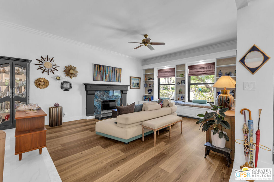 12 Santa Clara Drive Rancho Mirage, CA 92270 - Photo 5 of 34 a living room with furniture a fireplace and a flat screen tv