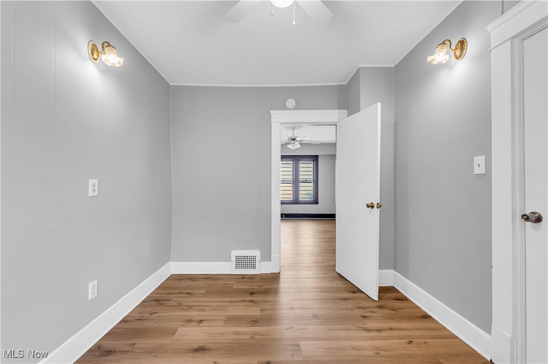 4408 Alpha Avenue Cleveland, OH 44105 - Photo 19 of 41 Spare room with ceiling fan and light hardwood / wood-style floors