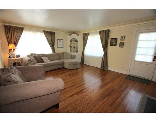 4670 Old Boston Road Whitehall, PA 15227 - Photo 3 of 18 Living Room. Crown molding + hardwood floor + large windows + built-in corner cabinet + door to the rear yard + neutral wall color = great living room!!