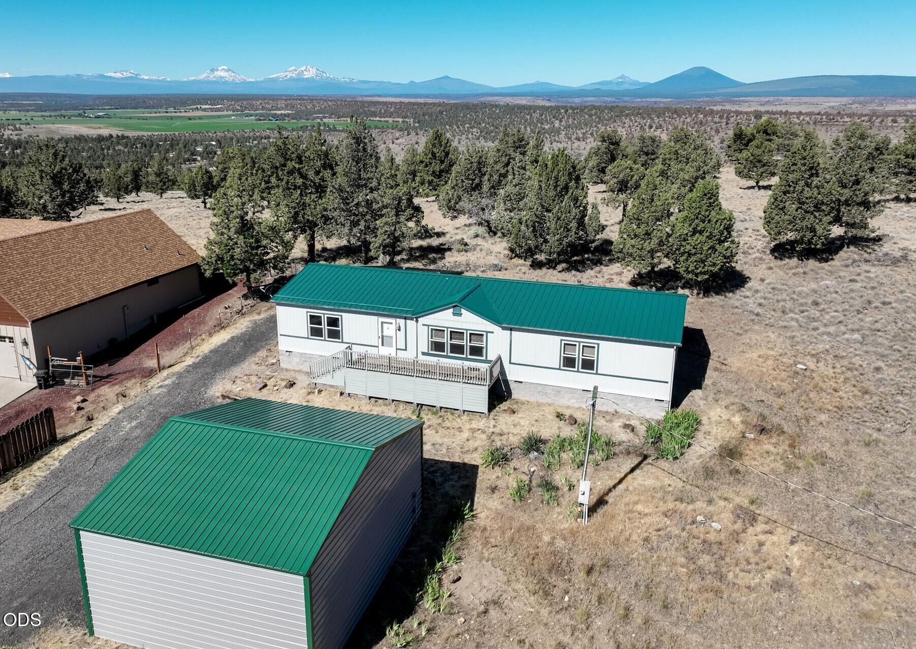 8628 Southwest Crater Loop Road Terrebonne, OR 97760 - Photo 2 of 36 an aerial view of a house with a garden