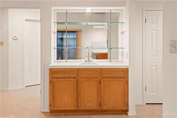 a bathroom with a sink and a mirror