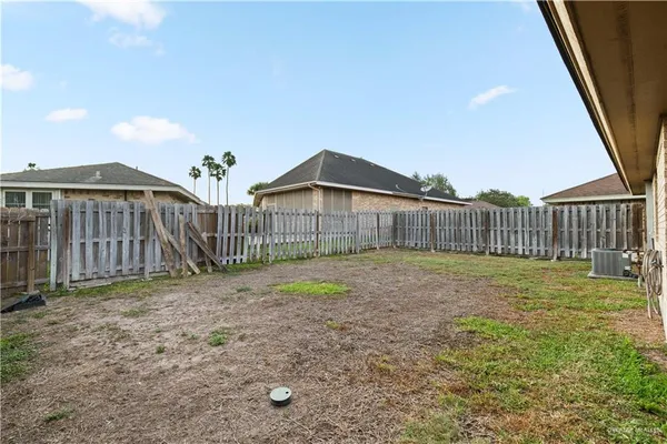 an aerial view of house with a yard