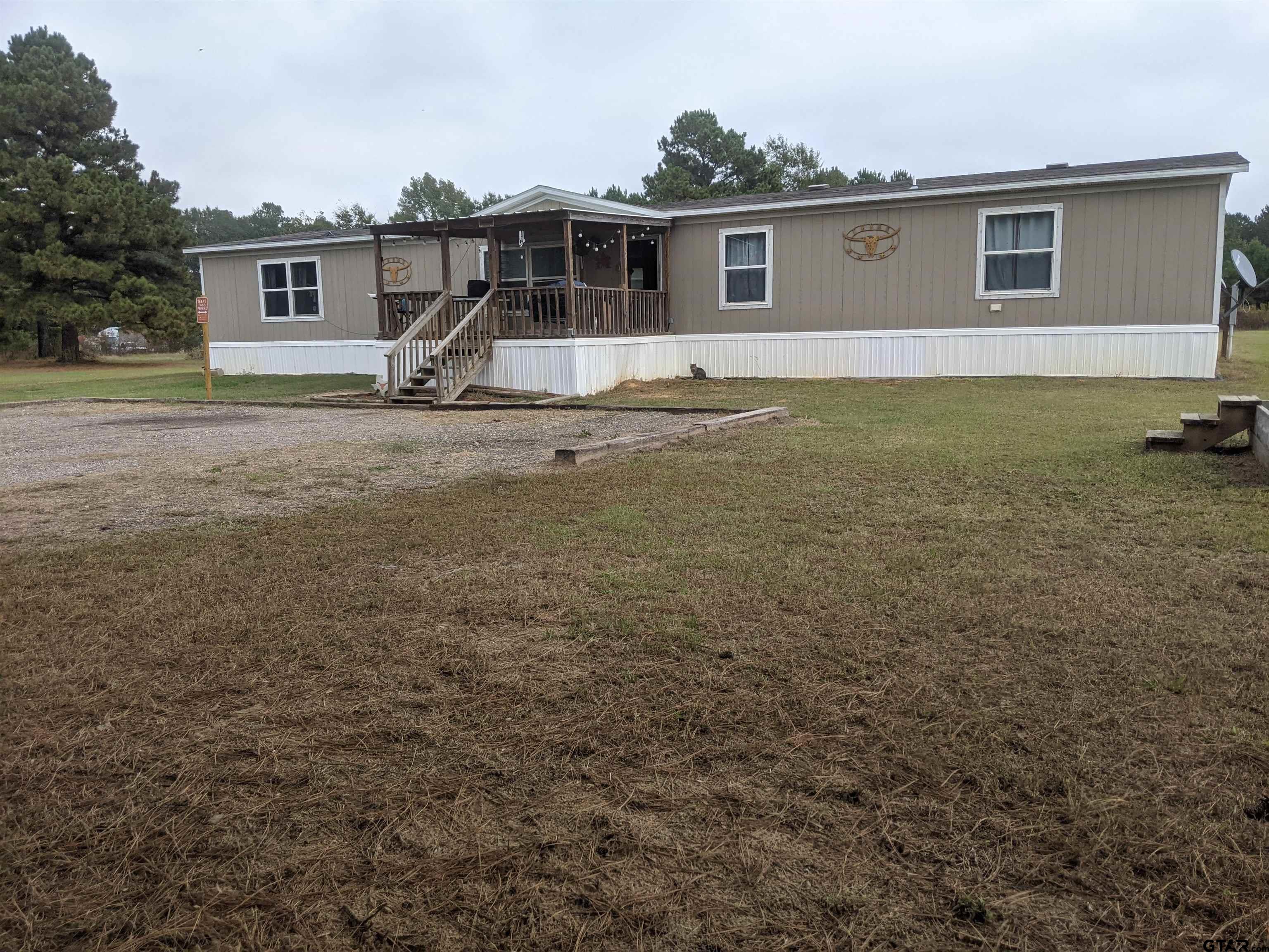 a front view of a house with yard