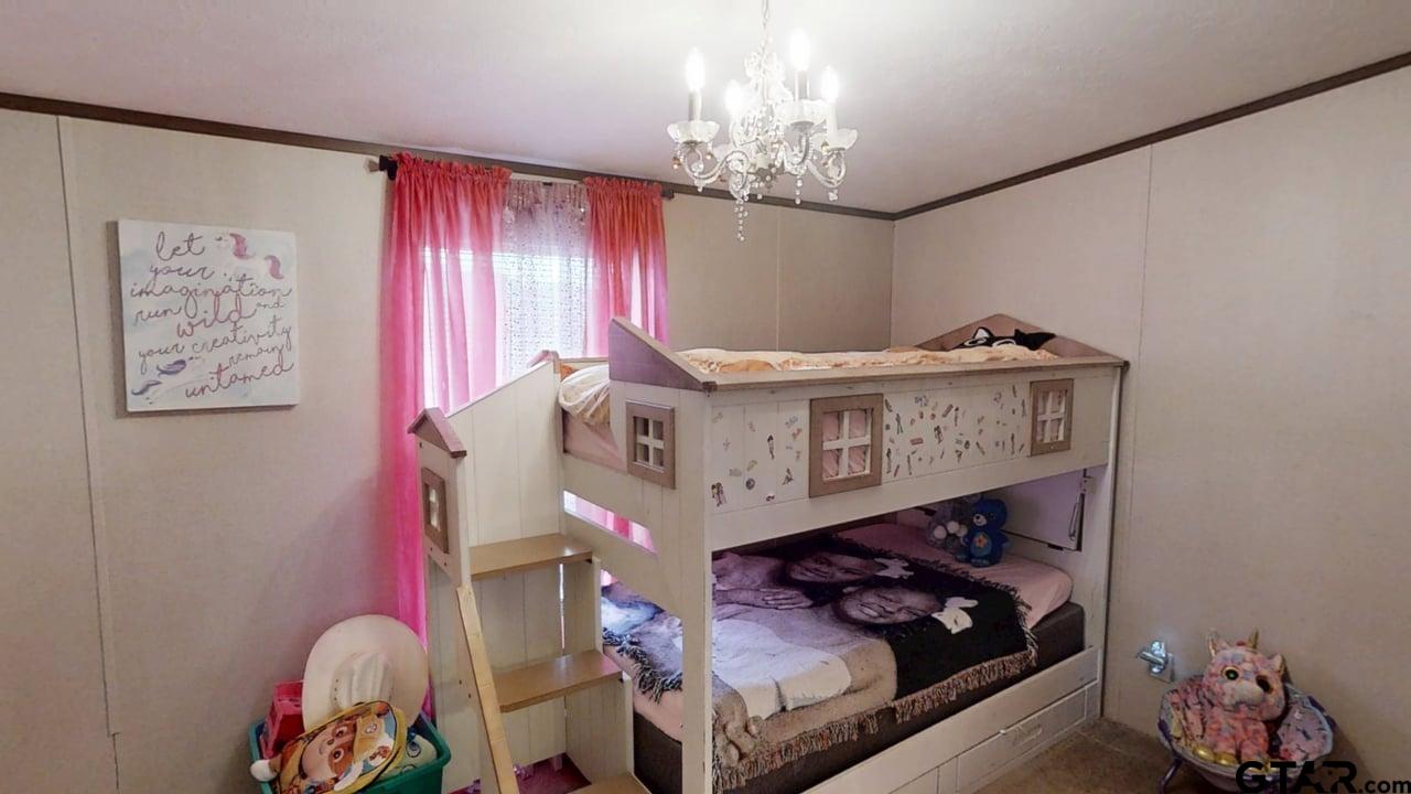 16910-c R 349 C R 349 Winona, TX 75792 - Photo 12 of 19 a living room with furniture and a chandelier