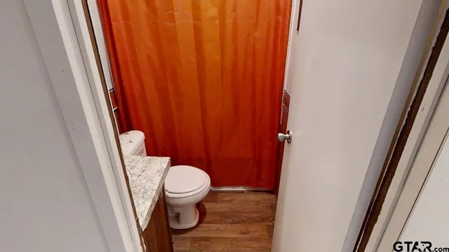 a bathroom with a sink and toilet
