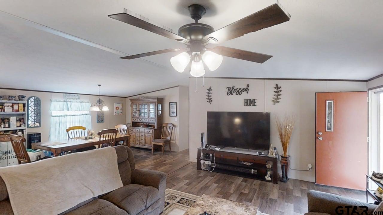 16910-c R 349 C R 349 Winona, TX 75792 - Photo 3 of 19 a living room with furniture and a flat screen tv