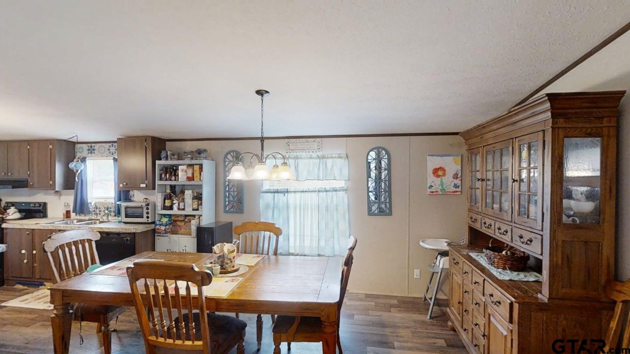 16910-c R 349 C R 349 Winona, TX 75792 - Photo 4 of 19 a view of a dining room with furniture window and wooden floor