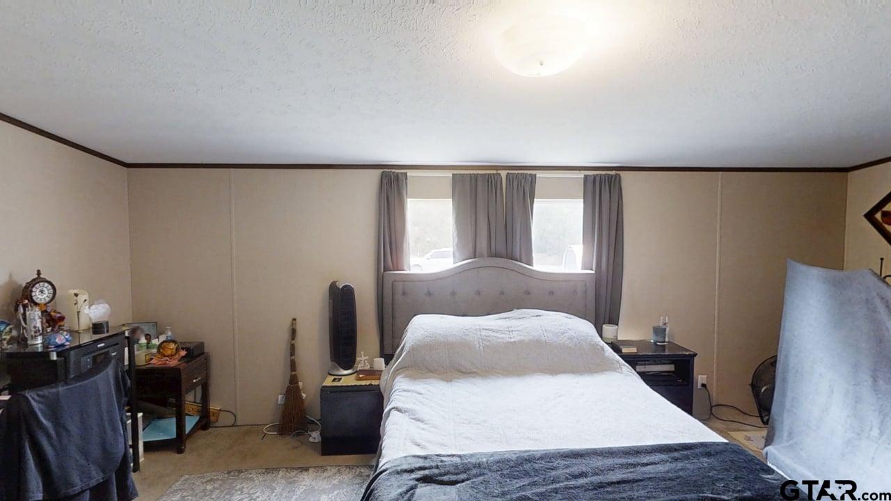 16910-c R 349 C R 349 Winona, TX 75792 - Photo 9 of 19 a bedroom with a bed and wooden floor