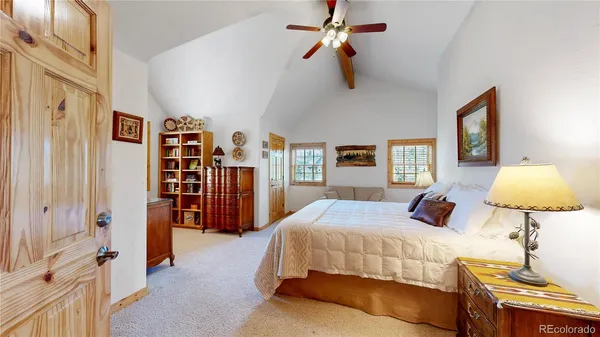 a bedroom with a bed and a lamp