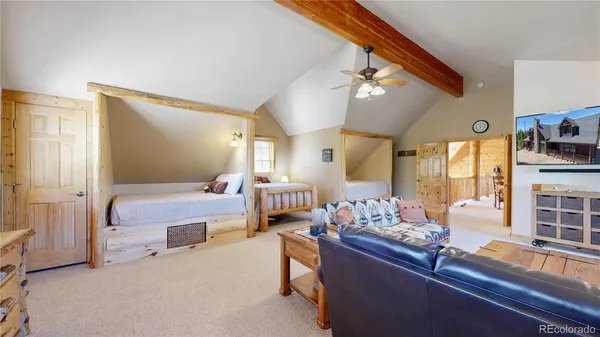a bedroom with furniture and a chandelier
