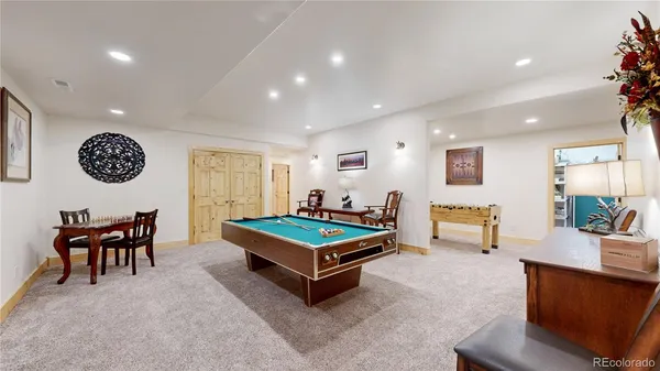 a living room with furniture a table and a flat screen tv