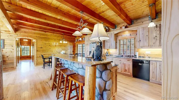 a kitchen with stainless steel appliances granite countertop a stove and refrigerator