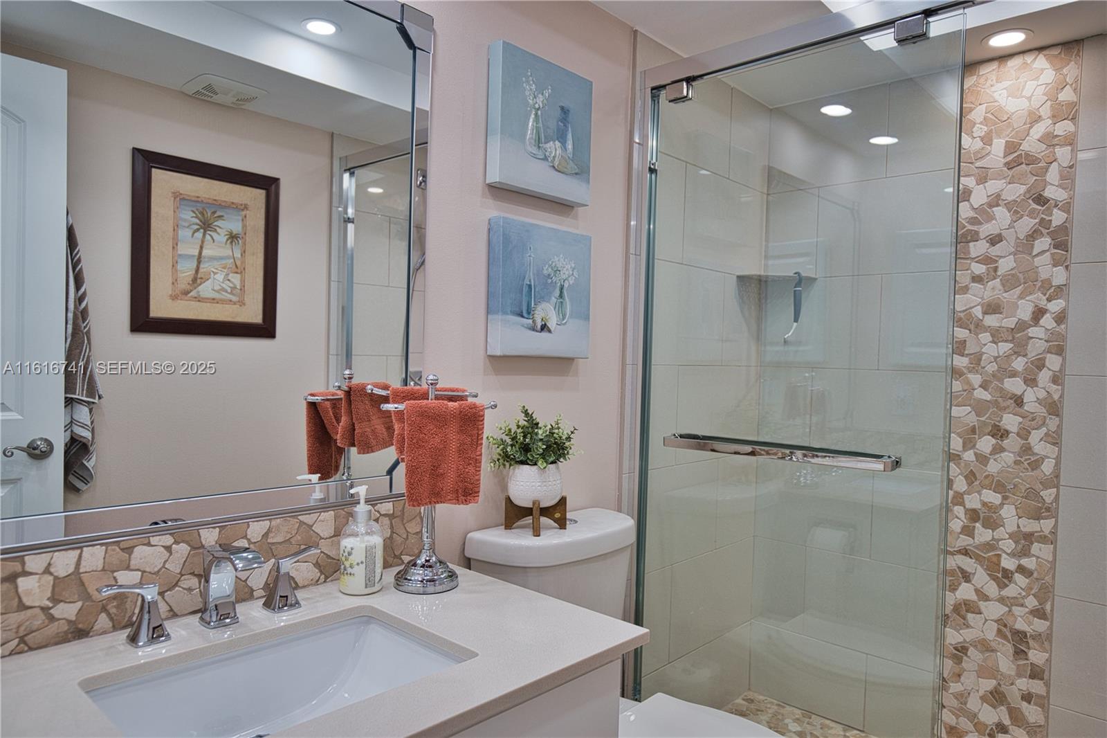 2810 North Beach Road, Unit D108 Englewood, FL 34223 - Photo 14 of 44 a bathroom with a sink toilet and shower