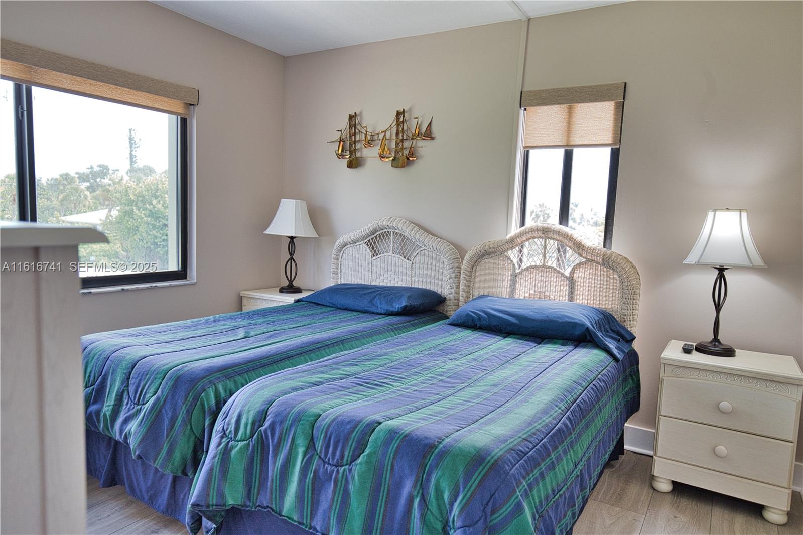 2810 North Beach Road, Unit D108 Englewood, FL 34223 - Photo 17 of 44 a bedroom with a bed and a window