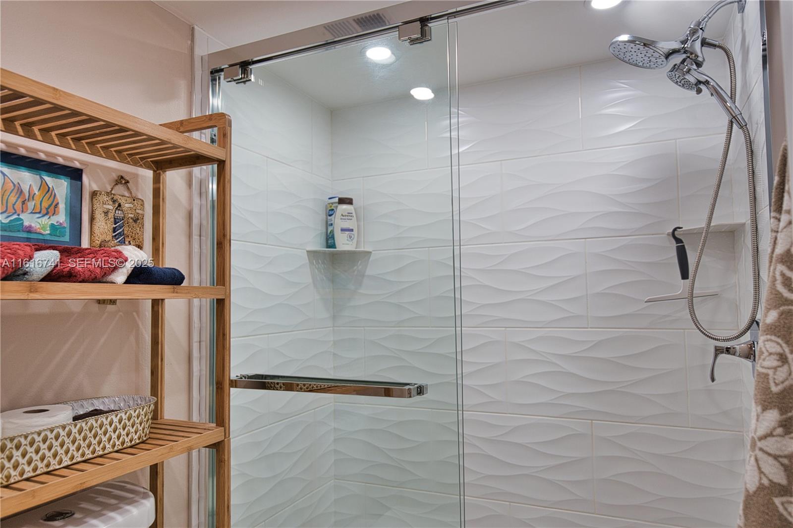 2810 North Beach Road, Unit D108 Englewood, FL 34223 - Photo 20 of 44 a bathroom with a shower