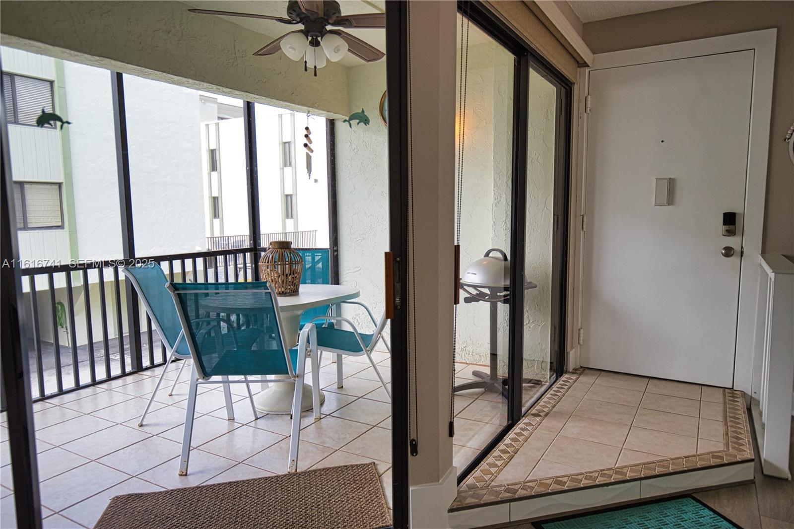 2810 North Beach Road, Unit D108 Englewood, FL 34223 - Photo 21 of 44 a view of a hallway with a dining area the entryway