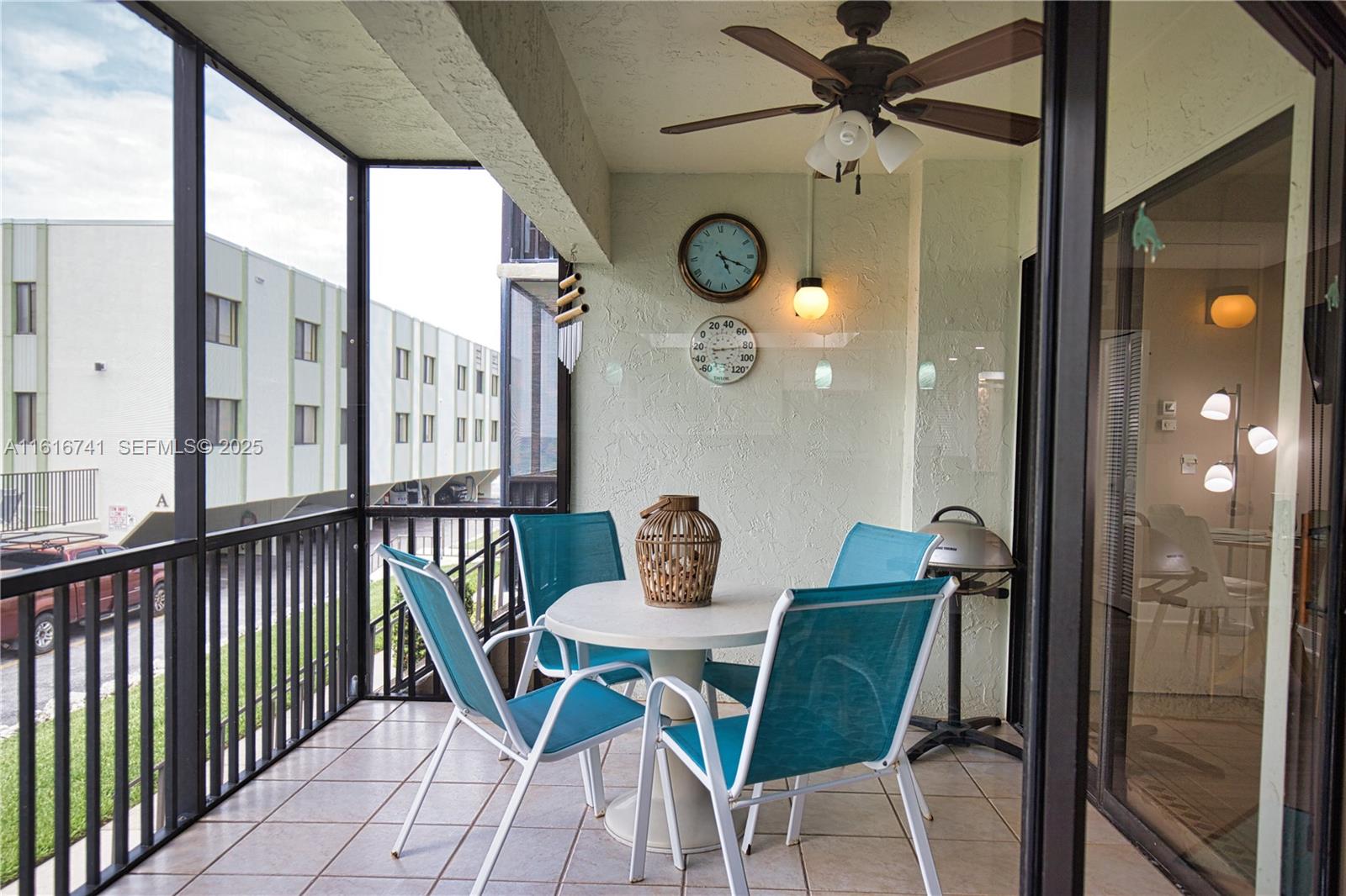 2810 North Beach Road, Unit D108 Englewood, FL 34223 - Photo 22 of 44 a view of a dining room with furniture window and outside view