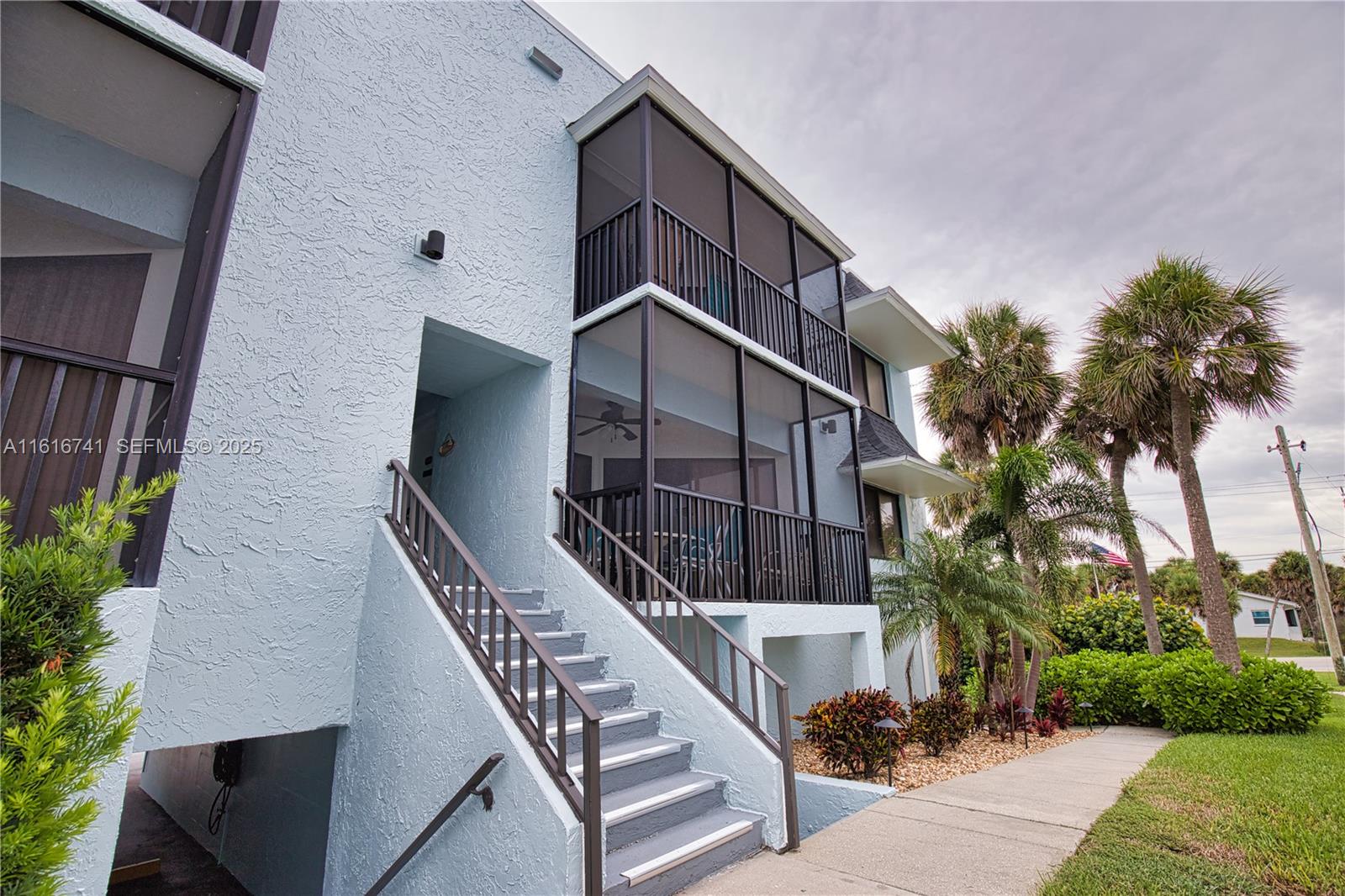 2810 North Beach Road, Unit D108 Englewood, FL 34223 - Photo 32 of 44 a view of balcony with wooden floor and fence and a potted plant