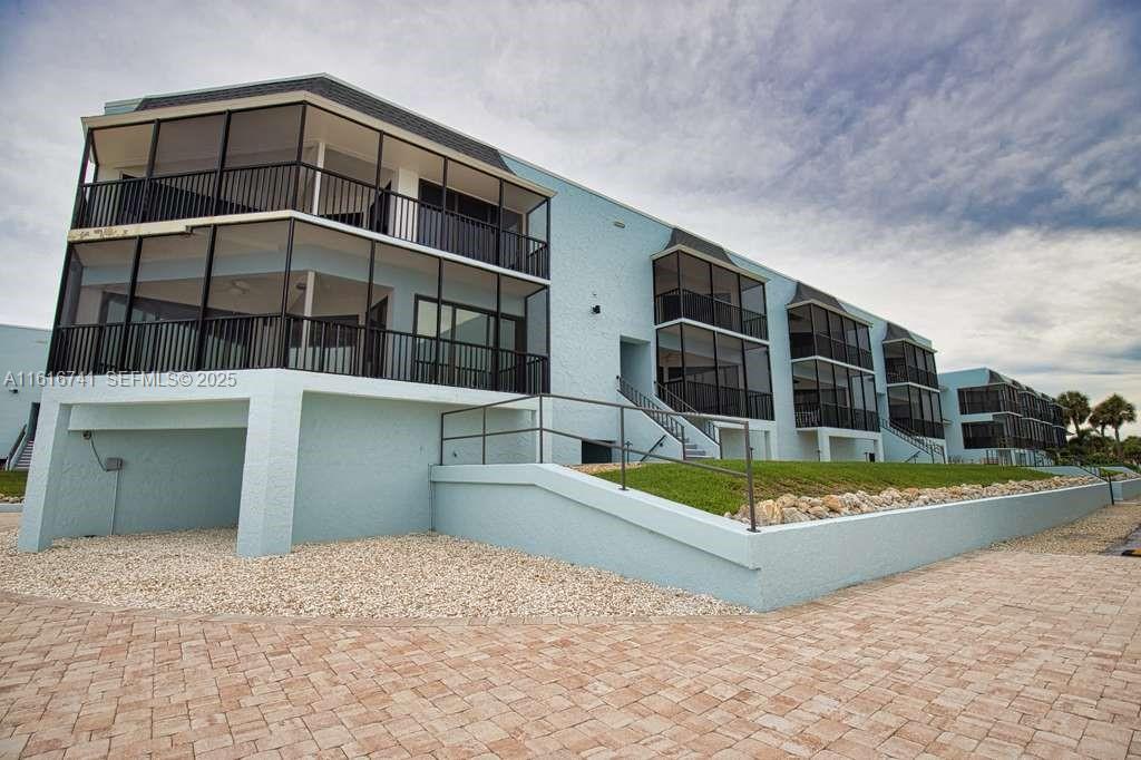 2810 North Beach Road, Unit D108 Englewood, FL 34223 - Photo 40 of 44 a view of a house with a backyard