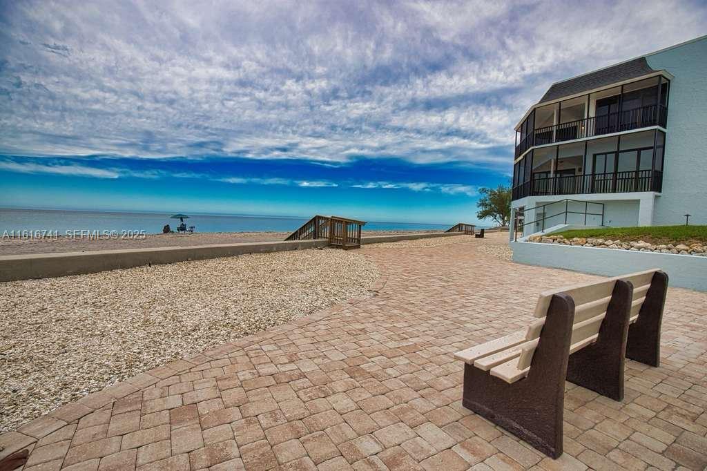 2810 North Beach Road, Unit D108 Englewood, FL 34223 - Photo 44 of 44 a terrace view with two chairs