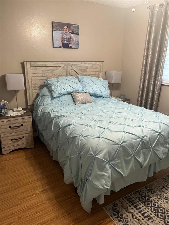 12900 Vonn Road, Unit B202 Largo, FL 33774 - Photo 13 of 23 a bedroom with a bed and a window