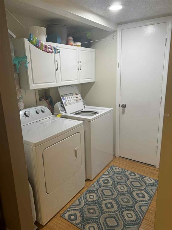 12900 Vonn Road, Unit B202 Largo, FL 33774 - Photo 17 of 23 a utility room with dryer and washer