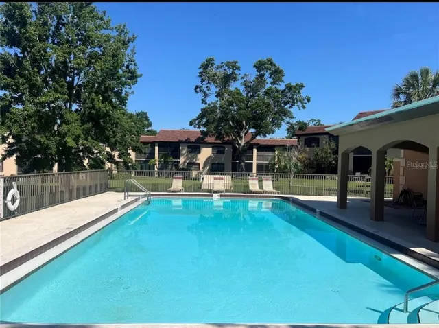 a view of a swimming pool with a patio