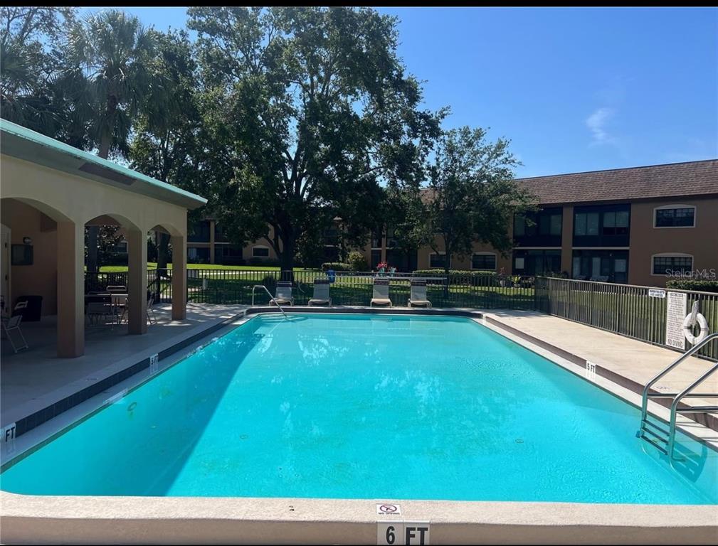 12900 Vonn Road, Unit B202 Largo, FL 33774 - Photo 21 of 23 a view of a swimming pool with a patio