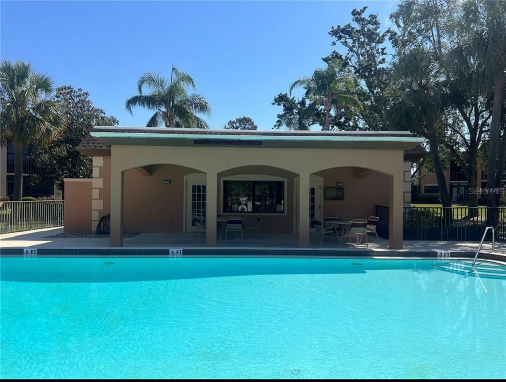 12900 Vonn Road, Unit B202 Largo, FL 33774 - Photo 23 of 23 a view of a house with a yard and sitting area
