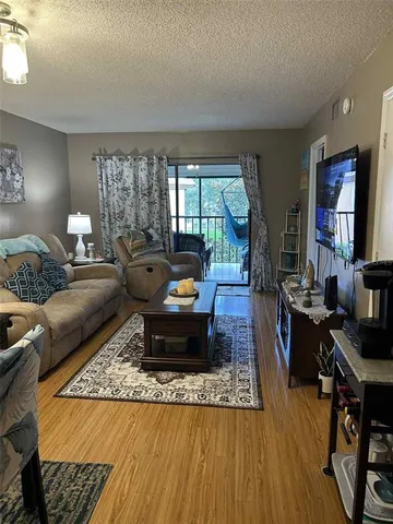 a living room with furniture and a table