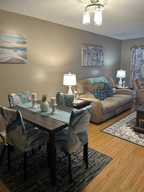 12900 Vonn Road, Unit B202 Largo, FL 33774 - Photo 5 of 23 a living room with furniture and a table