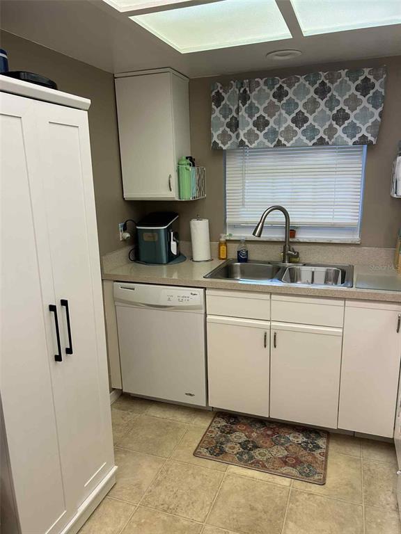 12900 Vonn Road, Unit B202 Largo, FL 33774 - Photo 6 of 23 a kitchen with a sink and cabinets