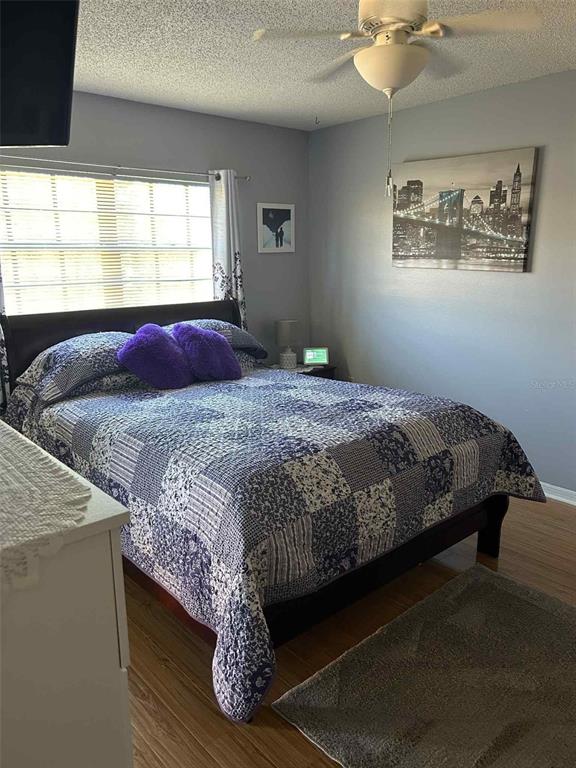 12900 Vonn Road, Unit B202 Largo, FL 33774 - Photo 8 of 23 a bedroom with a bed and window