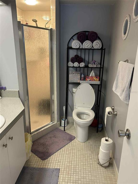12900 Vonn Road, Unit B202 Largo, FL 33774 - Photo 10 of 23 a bathroom with a toilet and a shower